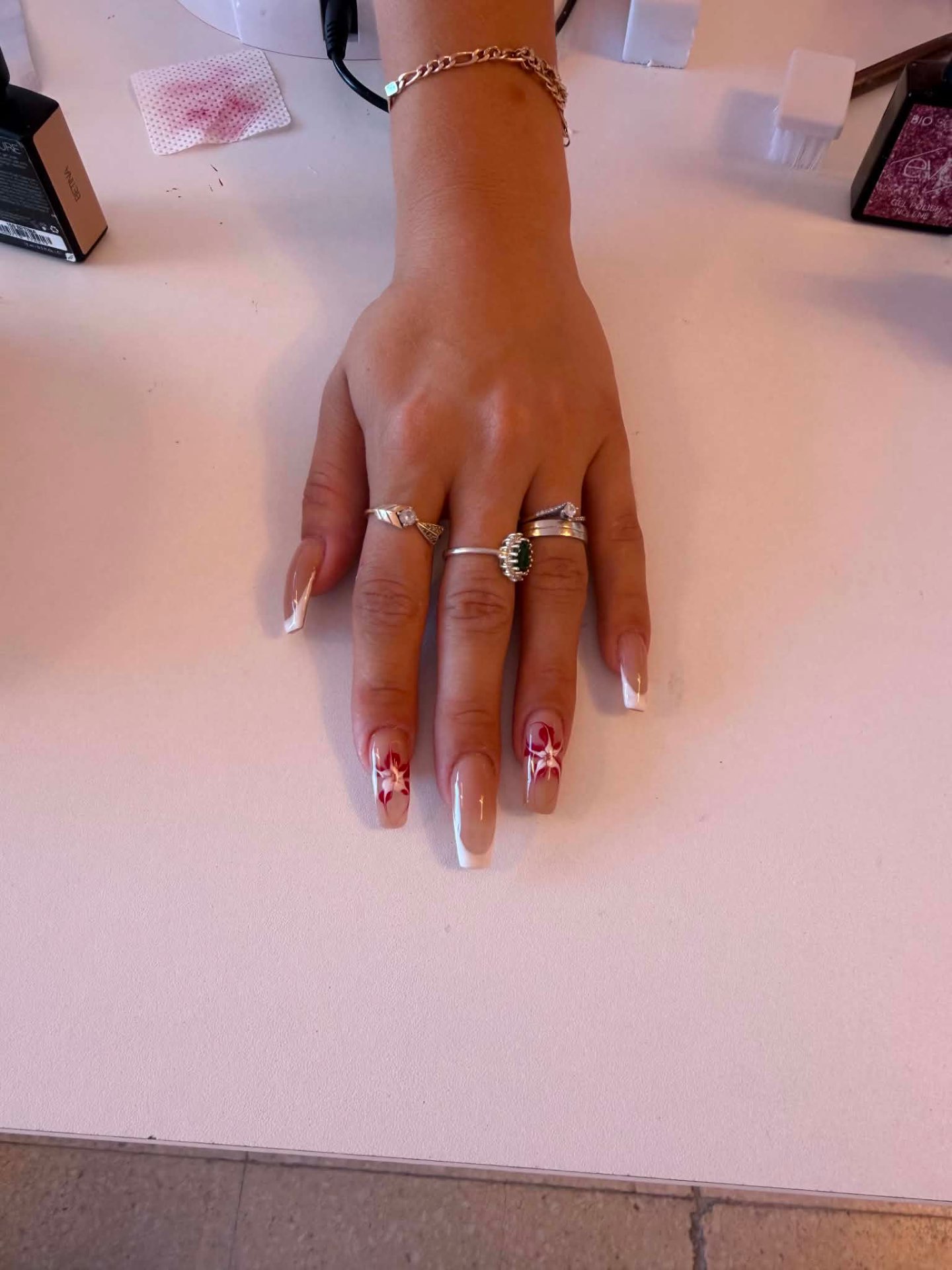 French nails with red flower accent art