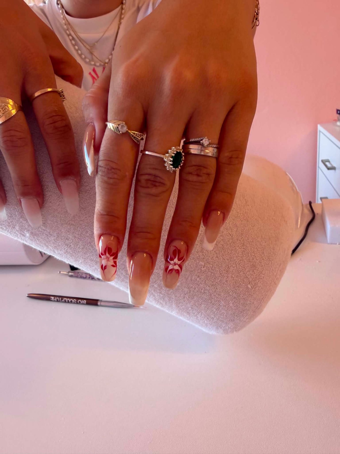Nude nails with red and white floral art