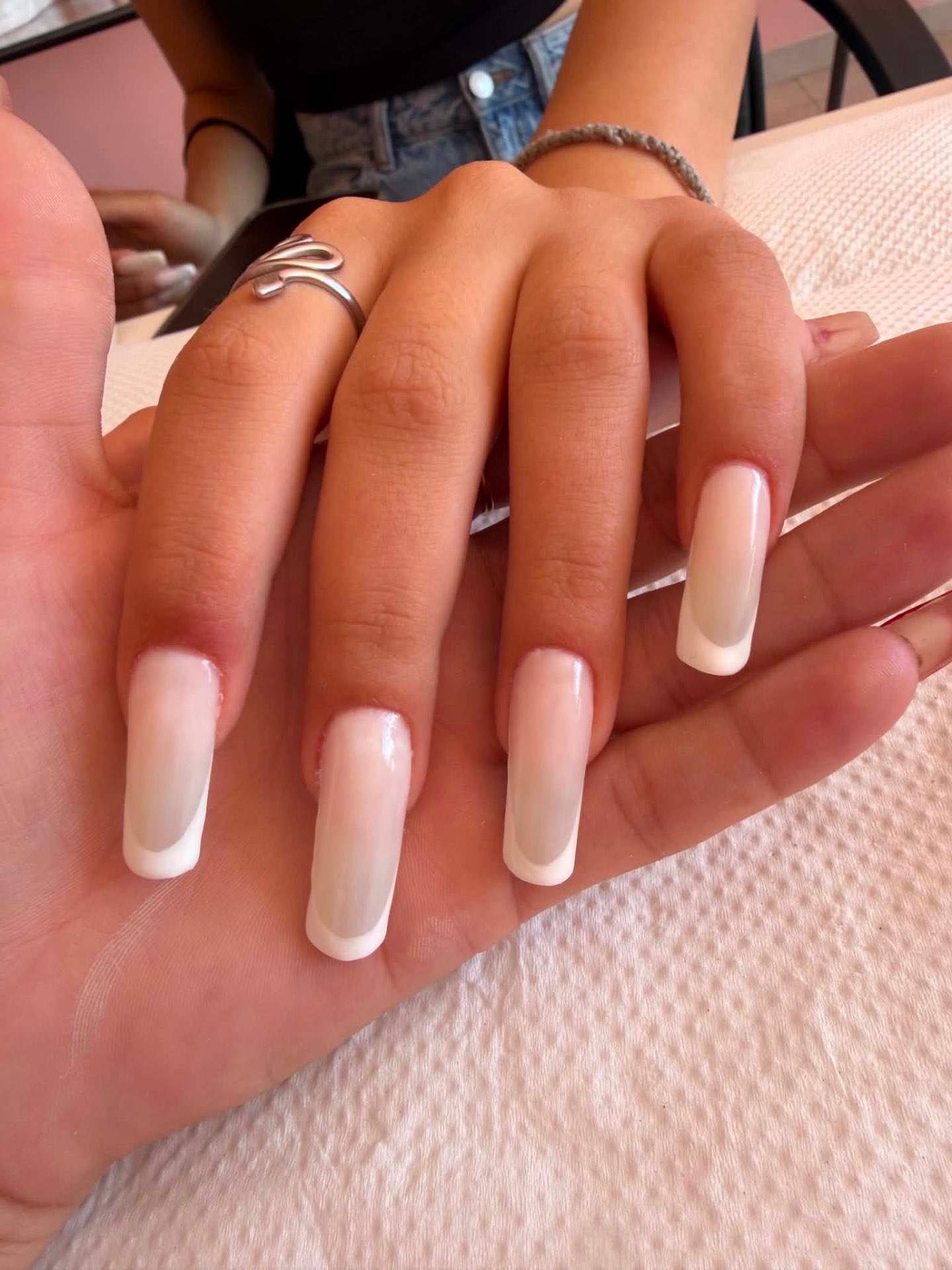 Long square French nails in soft nude